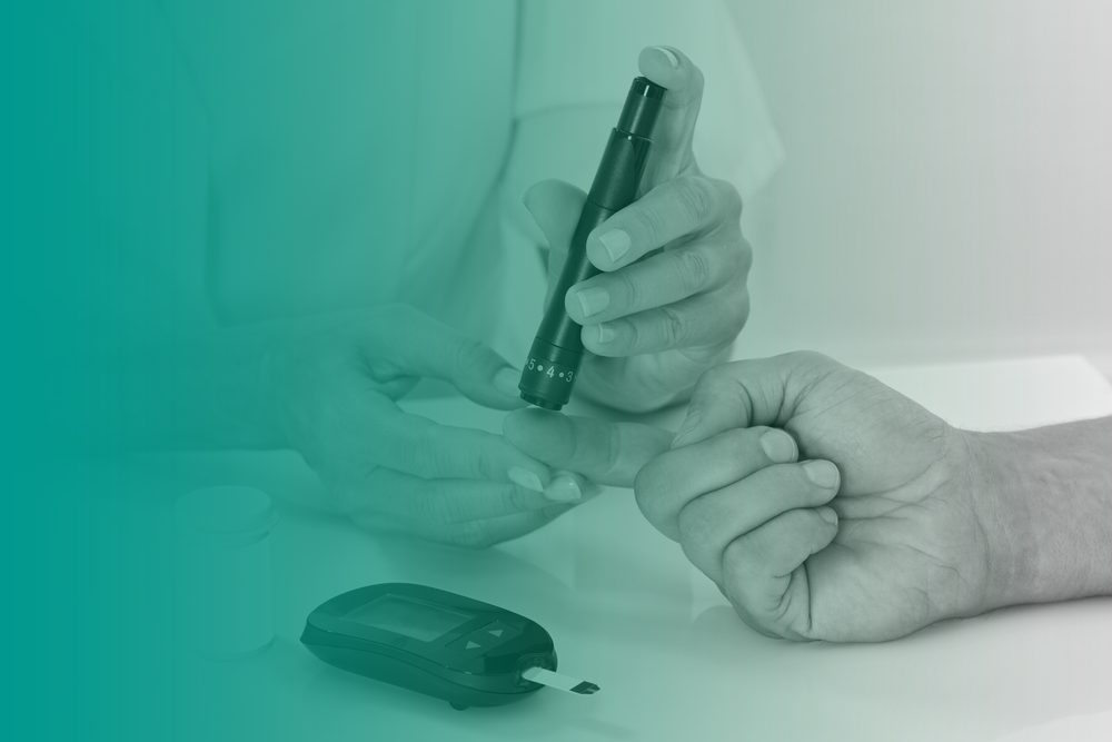 A close up of a medical practitioner doing a blood sugar check (blood glucose check) as part of someone's diabetes management.