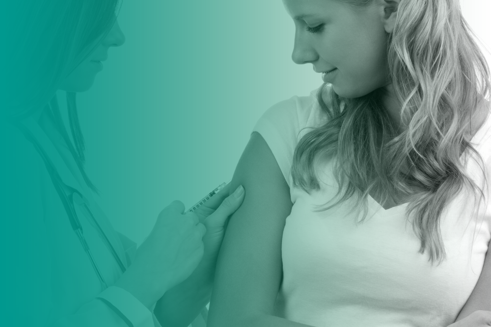 Someone receiving a vaccination as part of their travel health.