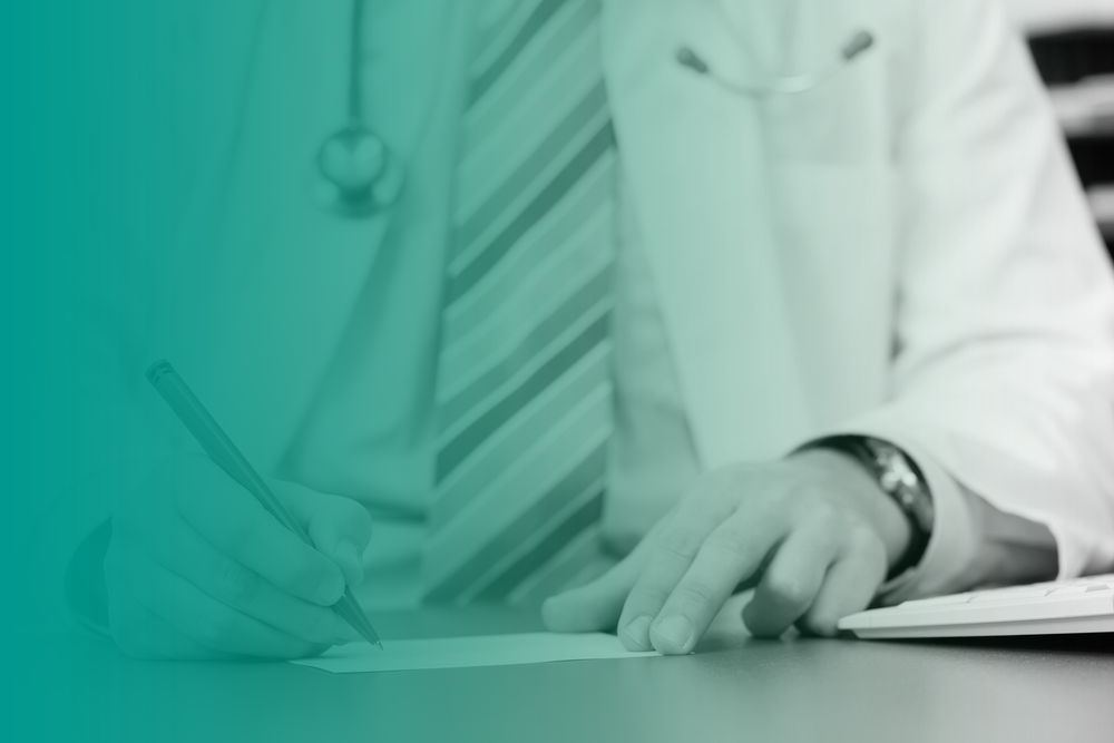 A close up of a medical practitioner, wearing a tie, lab coat and stethoscope, writing a medical certificate.